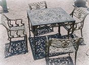 Cast aluminum Dolphin patio dining set, model A-5004, includes four chairs and one table