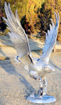 large eagle statue with fish in claw